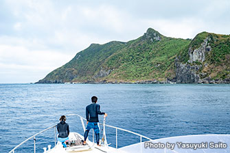 Staff anchoring the boat